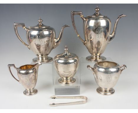 An early 20th century American sterling five-piece tea set, each of ovoid form with angular handles, on a circular foot, init