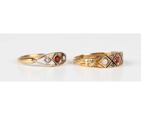 A gold, ruby, opal and diamond ring, mounted with a cushion cut ruby between two circular opals, each in a lozenge shaped set