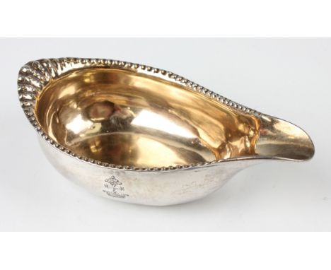 A George III silver pap boat with beaded rim and gilt interior, London (date letter rubbed) by Samuel Meriton II, weight 68.8