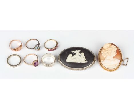 A 9ct gold mounted oval shell cameo brooch, carved as a portrait of a lady, weight 10.4g, width 3.3cm, a Wedgwood black basal