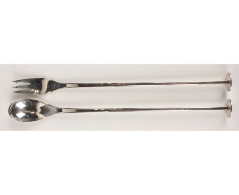 An Elizabeth II silver long-handled cocktail fork and matching spoon, each square handle with oval terminal, London 1978 by J