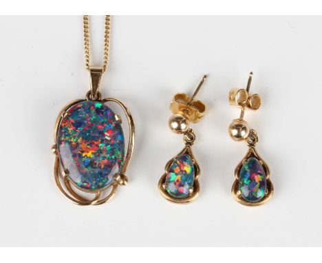 A gold mounted oval opal triplet pendant, detailed '375', length 2.5cm, with a 9ct gold neckchain on a boltring clasp, length