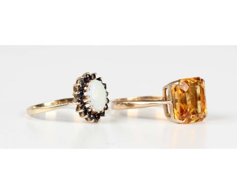 A gold ring, claw set with a cut cornered rectangular step cut citrine, detailed '18ct', weight 4.3g, ring size approx O, and