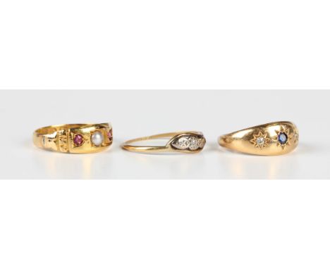 An Edwardian 18ct gold, sapphire and diamond ring, star gypsy set with a circular cut sapphire between two cushion cut diamon