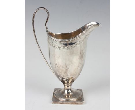 A George III silver helmet cream jug with engraved bands and monogram, with loop handle and square foot, London 1793 by Rober