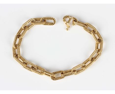 A French gold bracelet in a herring bone oval link design, detailed 'DJ Perrin', weight 29.3g, length 20cm.Buyer’s Premium 29