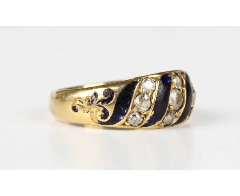 A Victorian gold, diamond and dark blue enamelled ring, mounted with seven cushion cut diamonds, otherwise with enamelled dec