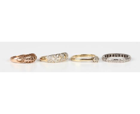 A diamond set eternity ring, unmarked, ring size approx O, a 9ct gold and diamond single stone ring, a 9ct gold and diamond s