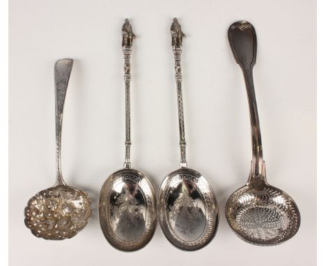 A pair of Victorian silver apostle serving spoons, each oval bowl engraved with flowers and leaves, Sheffield 1873 by Walker 