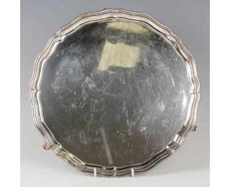 A George VI silver circular salver with piecrust rim, raised on scroll legs, Chester 1937 by S. Blanckensee &amp; Son Ltd, we