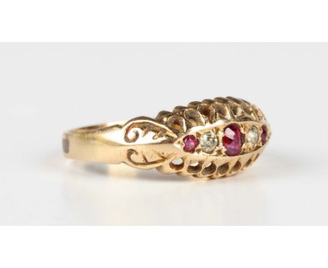 A gold, ruby and diamond ring, circa 1910, mounted with three rubies alternating with two diamonds in a boat shaped setting, 