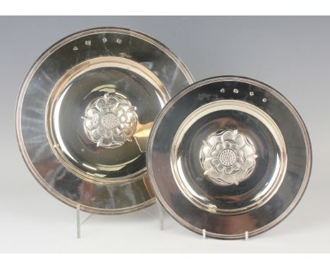 An Elizabeth II silver circular Tudor Rose dish, London 1967, diameter 30.5cm, and another similar smaller example, London 19