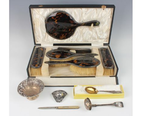 A George V silver and tortoiseshell six-piece dressing table set, comprising hand mirror, two hair brushes, two clothes brush