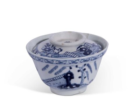 A rare Lowestoft porcelain sucrier and a cover c.1765 painted in blue and white with a chinoiserie design of rockwork and flo