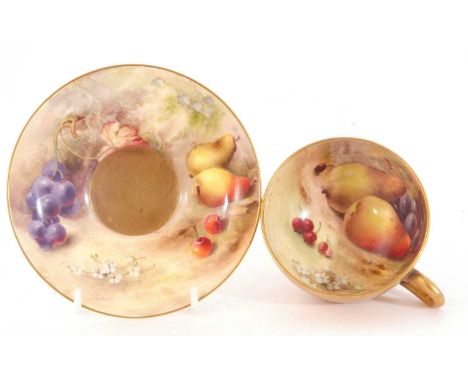 A mid 20th century Royal Worcester cup and saucer with gilt exterior the interior painted with fruit by Rickettssaucer 12cmgo