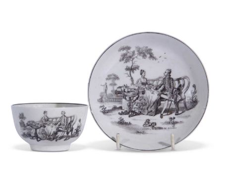 A Worcester teabowl and saucer c.1765 printed in black with the Tea Party No.2 print by Robert Hancock the saucer signed RH W