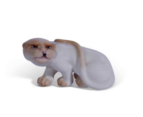 A Royal Worcester netsuke model of a cheetah or white panther c.1912/13 green factory mark to base and RD no: 6559748cm longG