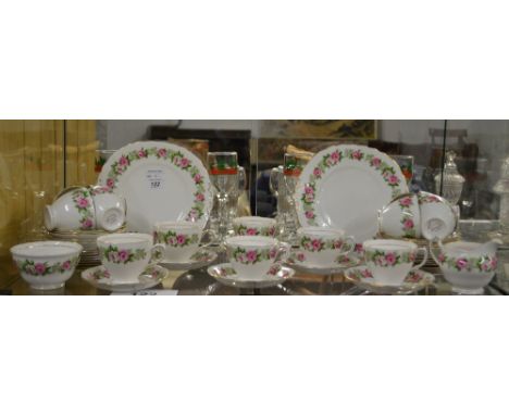 A comprehensive colclough tea service, florally decorated with gilt banding