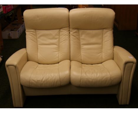 A John Lewis' reclining 'aircraft' style two seater cream leather sofa 