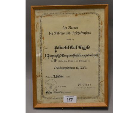 A medal-certificate for the four-year service medal, Wermacht (Army) for an interesting Panzer-unit. Dated 1936. Framed and g