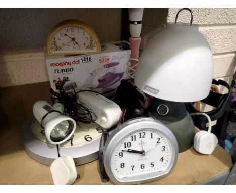 Mixed collection of items, including a BNIB steam iron, clocks and a table lamp etc. All electrical items in this lot have be