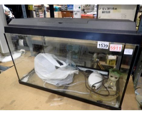 Juwel aquarium with pump and lighting, 60 x 30 x 30cm H. All electrical items in this lot have been PAT tested for safety and