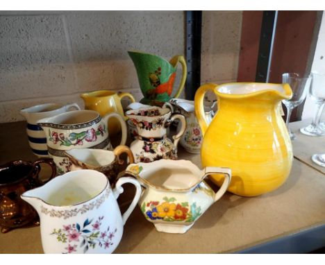 Shelf of mixed jugs, including Beswick and Masons. Not available for in-house P&amp;P