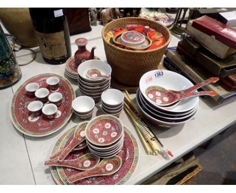 Substantial set of Chinese ceramic tableware including a teapot in a basket case, excellent condition, no cracks or chips. No