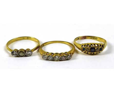 A 18ct gold and diamond five stone ring, size K/L, together with two other 18ct gold rings, one with two diamonds and a white