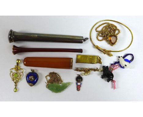 A group of jewellery and objects of vertu, comprising a cherry amber and gold mounted cigarette holder complete with shaped s