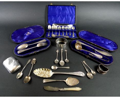 A group of silver items, comprising a Victorian berry spoon, Walker & Hall, Sheffield 1897, a cased Christening set with spoo