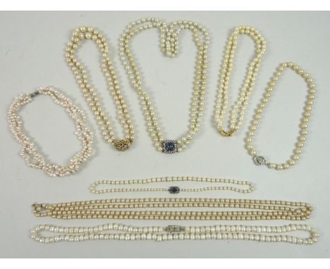 A group of cultured pearl and faux pearl necklaces, comprising a double strand, each 8mm, with silver clasp set with a large 