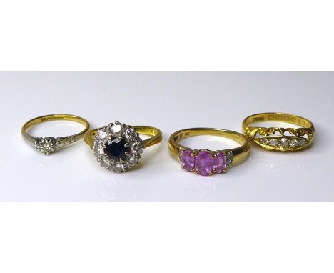 A group of three 18ct gold dress rings, comprising a sapphire and diamond cluster ring, size M, a platinum, diamond and 18ct 