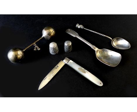 A Georgian silver penknife with mother of pearl handle, a James Usher style silver teaspoon with a terminal cast of the Linco