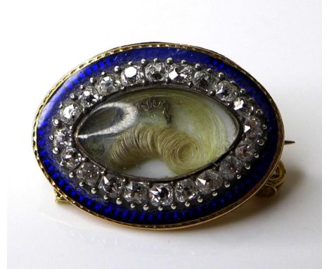 A mid 19th century 15ct gold mourning brooch of oval form, the central marquise surrounded by twenty diamonds with a blue ena