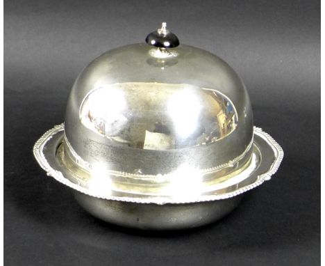 A George V silver muffin dish, of circular domed form, with black plastic finial, removable tray, and shaped rim with gadroon