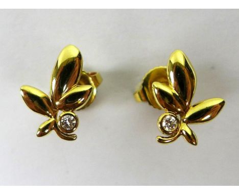 A pair of Tiffany & Co 18ct gold and diamond stud earrings of Olive Leaf design by Paloma Picasso, with diamond inset to the 