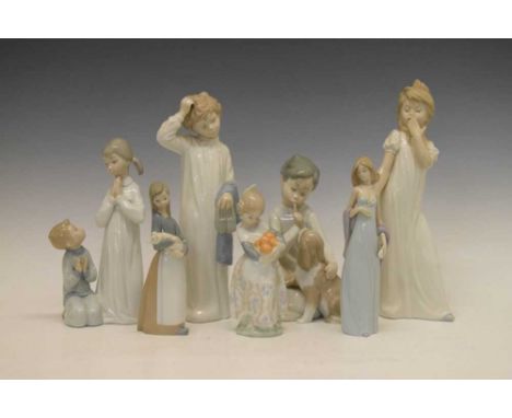 Five Lladro porcelain figures comprising; 'Valencia girl orange seller' (4841), 'Boy with Dog' (4522), 'Teaching to Pray' (47