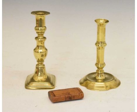 Two Georgian brass candlesticks one with petal base, 18cm and 17cm high, and a snuff box (3)