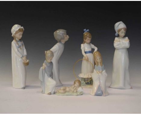 Four Lladro porcelain children figures, together with three Nao figures, tallest 27cm (7)