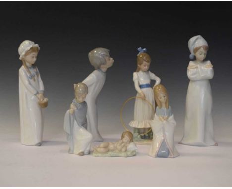 Four Lladro porcelain children figures, together with three Nao figures, tallest 27cm (7)