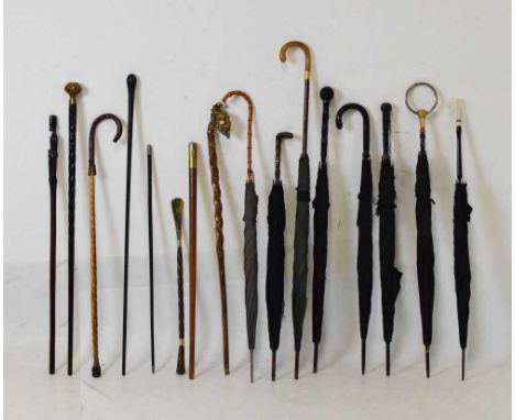 Assorted sticks and parasols to include; horn handle example, swagger sticks, African figure stick, etc, longest 87cm