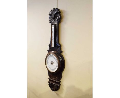 Early 20th Century carved oak aneroid barometer, 91cm high 