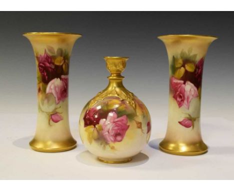 Royal Worcester - Two sleeve vases and an ovoid vase, each gilded and painted with roses, printed green and puce backstamps, 