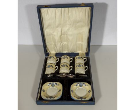 A cased set of six coffee cans and saucers