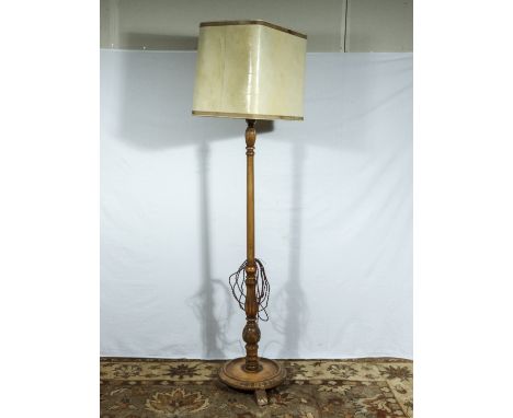 An oak standard lamp and shade