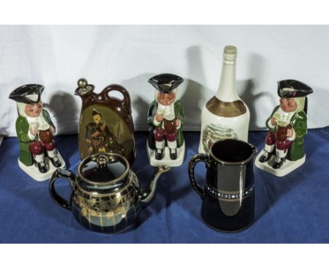 Three character jugs, teapot, water jug and a pottery flask