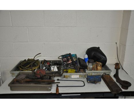 SIX TRAYS CONTAINING AUTOMOTIVE TOOLS including spanners, scales, straps, a welding mask, a vice, a shoe last, etc