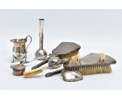 A SELECTION OF SILVER ITEMS, to include a three piece vanity set, such as a hair brush, clothes brush and a mirror, each piec