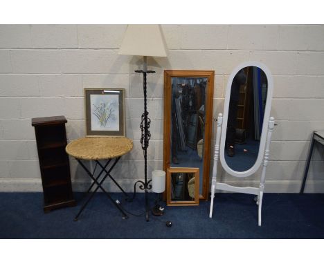 A WHITE PAINTED CHEVAL MIRROR, together with a wicker folding table, wrought iron standard lamp, table lamp, two pine wall mi